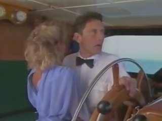 Candy Evans and John Leslie on a boat.