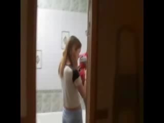 Skinny babe masturbating on the toilet