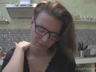 Solo mademoiselle with glasses chatting in the kitchen
