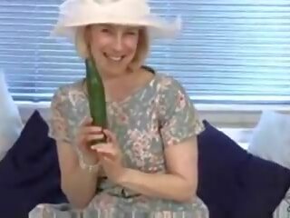 Nubile housewife fucks a cucumber